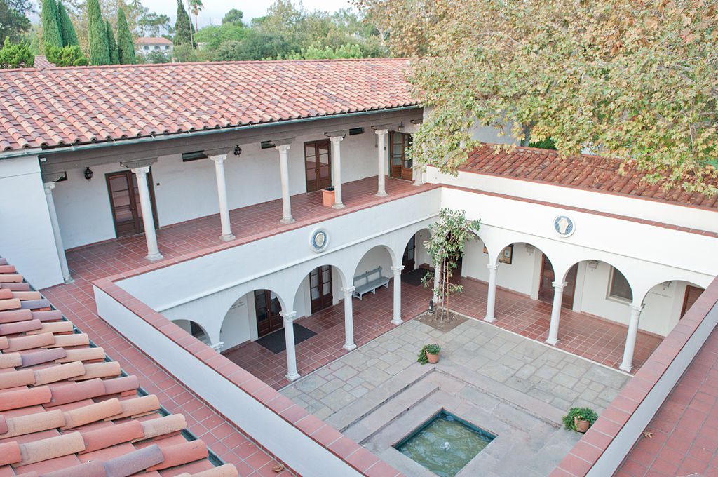 Courtyard at the Scripps College for Women with brick tiles, terracotta roofing and white arches