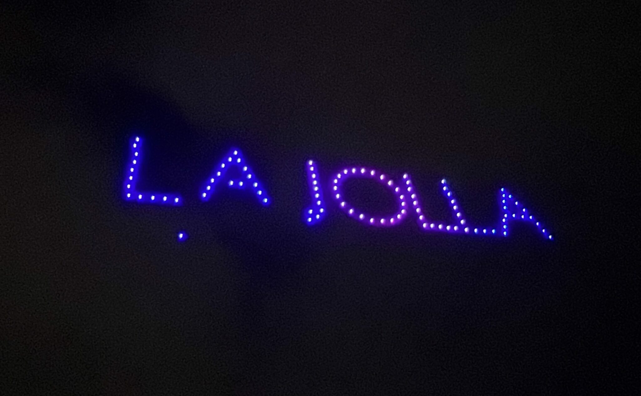 The July 4 drone show lights up the sky with "La Jolla' spelled out in the sky with purple and pink lights