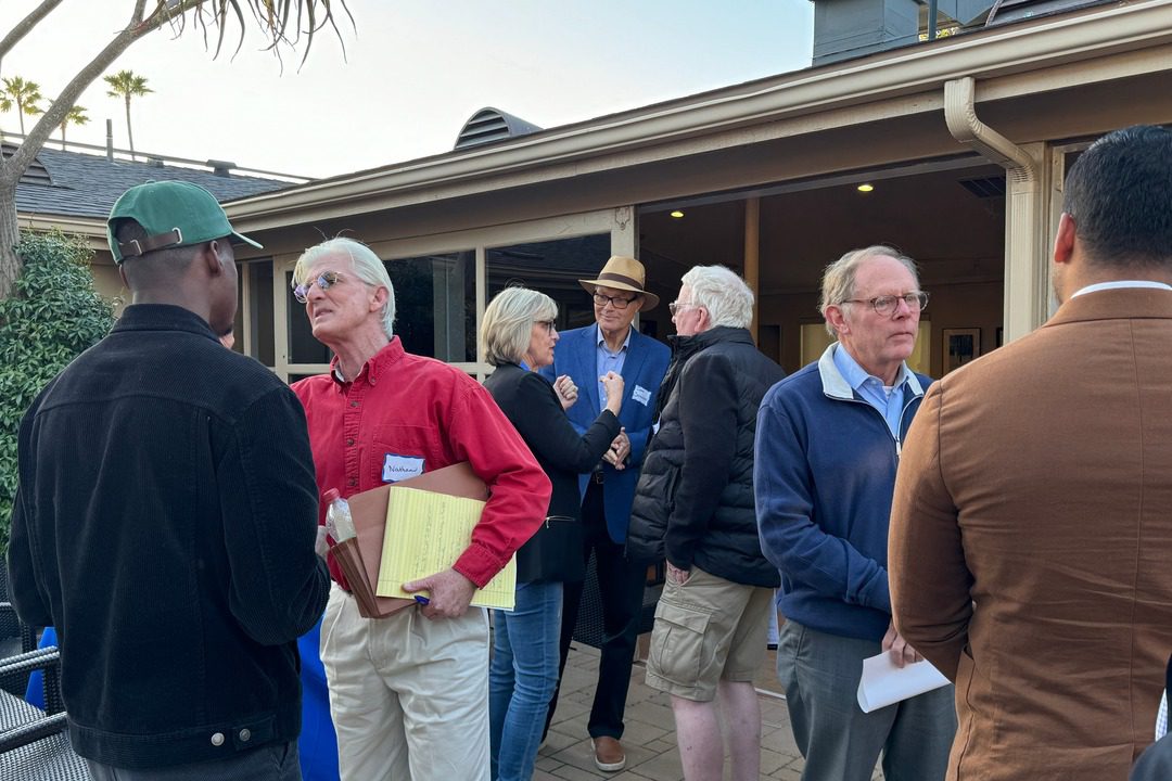 a group of people gather to meet and discuss at the 'one voice' forum hosted by the La Jolla town council